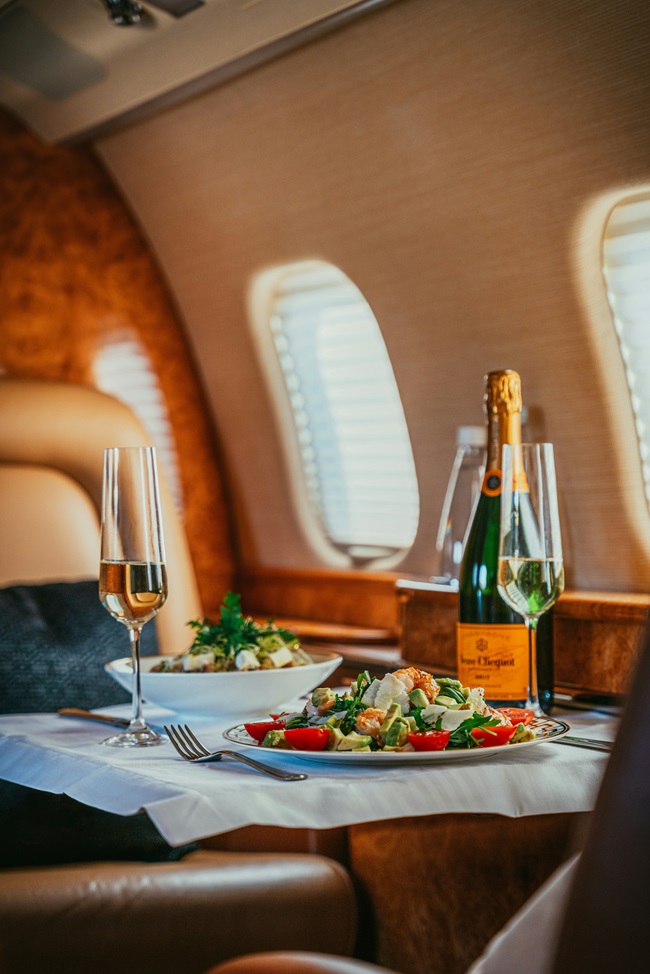 Champagne lunch on the table in a private jet